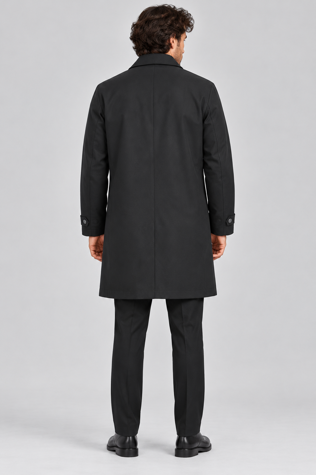 Men's black mac coat back view showing mid-thigh length